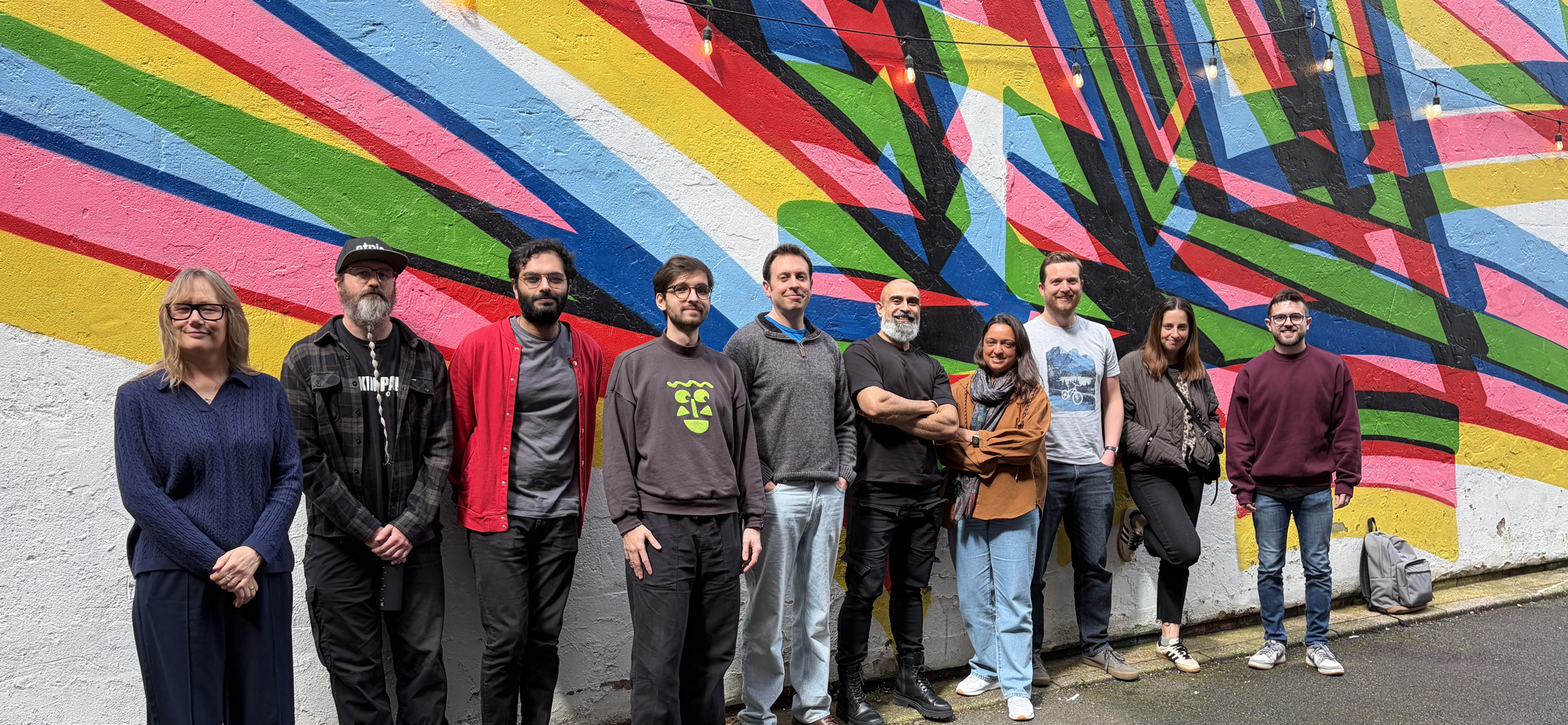 People standing in front of a wall